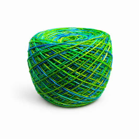 Ball of hand-dyed yarn in Seattle blue and green colorway